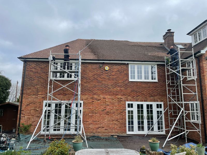 Roof cleaning carried out safely from scaffold towers by The Roof Moss Cleaners in Gosport